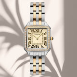 Φωτογραφία του γυναικείου ρολογιού Vogue Victoria 2020615262 με δίχρωμο μπρασελέ και σαμπανί καντράν, αναδεικνύοντας τον κομψό και λαμπερό σχεδιασμό του