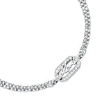 Γυναικείο βραχιόλι Karl Lagerfeld Crystals KLAYC33 φορεμένο στον καρπό σε ασημί χρώμα με λευκές πέτρες και λογότυπο.