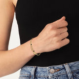 Γυναικείο βραχιόλι Lacoste 2040458 ατσάλινο σε χρυσό χρώμα από ανοξείδωτο ατσάλι.Το βραχιόλι έχει διπλή αλυσίδα, διακοσμείται με μικρές μαύρες στρογγυλές χάντρες και έχει ρυθμιζόμενο μήκος στα 18-22cm, φορεμένο