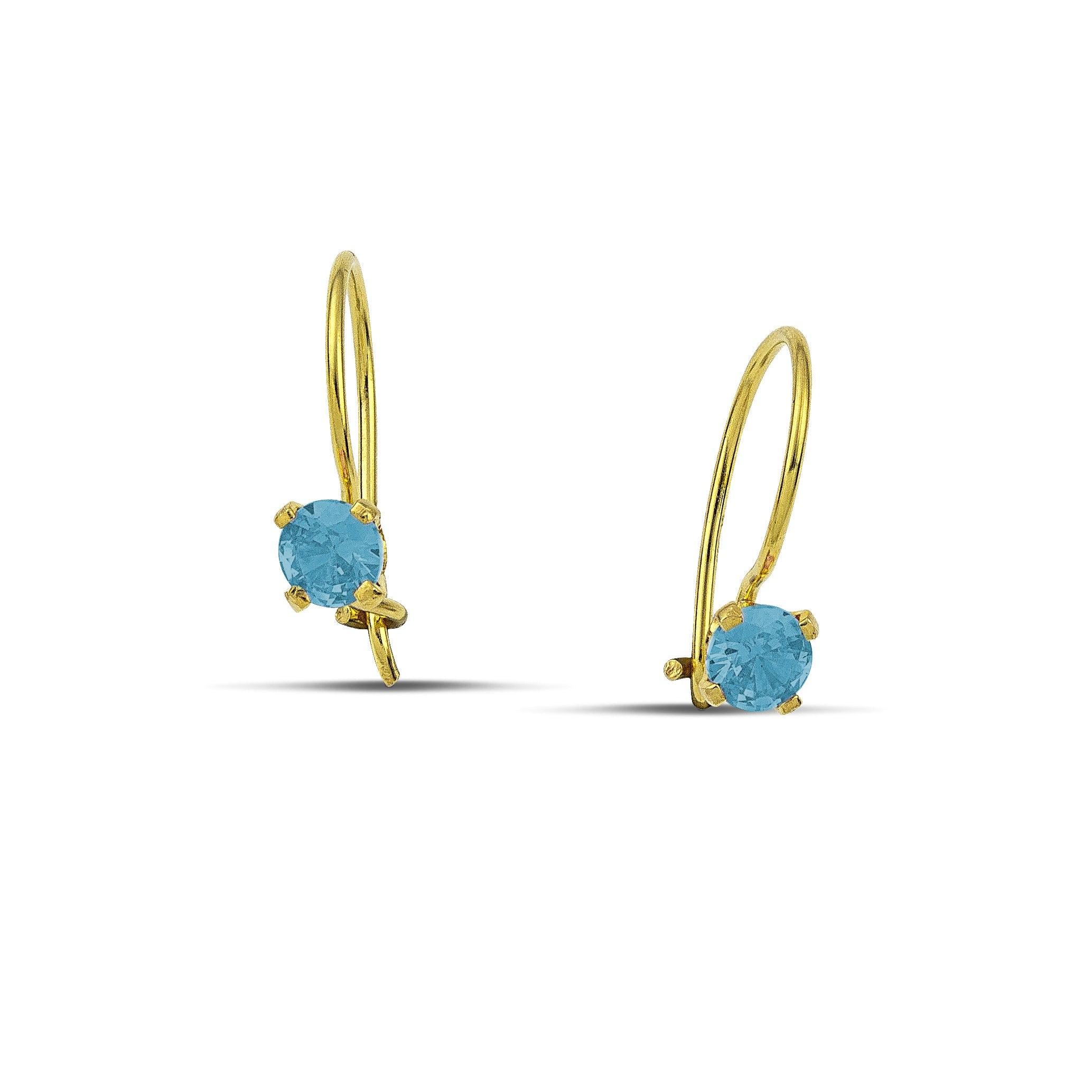 Κρεμαστά σκουλαρίκια από κίτρινο χρυσό 14 καρατίων με πέτρες από γαλάζιο ζιργκόν.