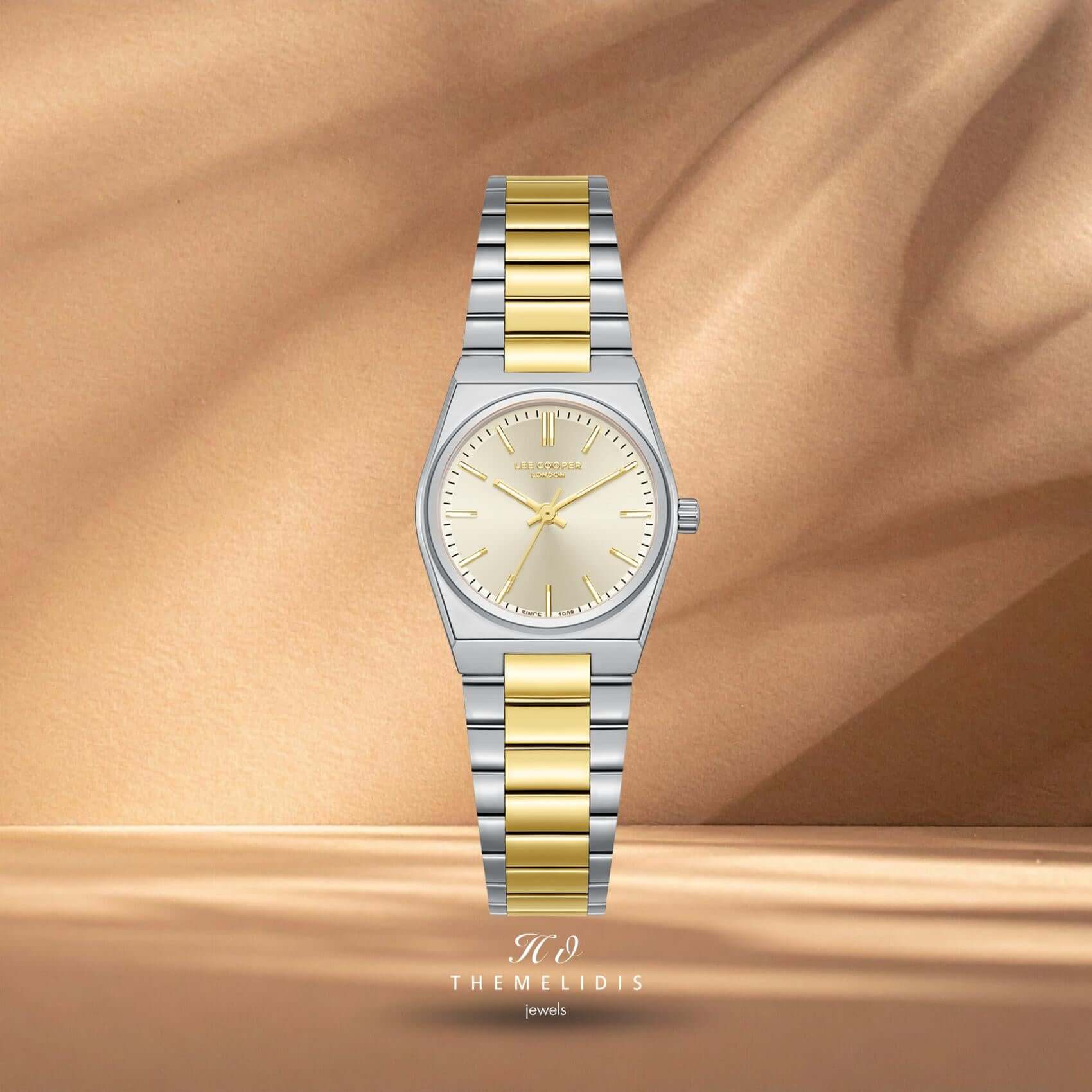 Γυναικείο ρολόι Lee Cooper Ladies LC08362.210 με χρυσό καντράν 25mm, χρυσούς δείκτες και δίχρωμο μπρασελέ σε ασημί και χρυσό χρώμα.
