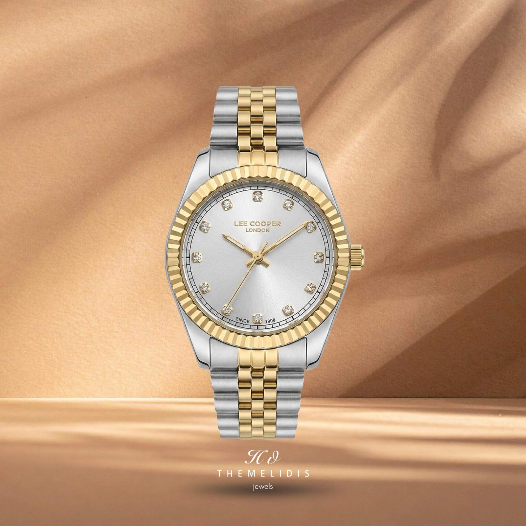 Γυναικείο ρολόι Lee Cooper Ladies LC08400.230 με ασημί καντράν 24mm, ζιργκόν και δίχρωμο μπρασελέ σε ασημί και χρυσό χρώμα.