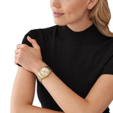 Γυναικείο ρολόι Michael Kors Lexington MK7378 χρονογράφος με χρυσό ατσάλινο μπρασελέ, στρογγυλό χρυσό καντράν με ημερομηνία και στεφάνι 38mm.