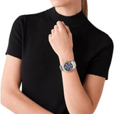 Γυναικείο ρολόι Michael Kors Lexington MK7218 χρονογράφος με δίχρωμο ασημί-χρυσό ατσάλινο μπρασελέ, στρογγυλό μπλε καντράν με ημερομηνία και στεφάνι 38mm.