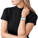 Γυναικείο ρολόι Michael Kors Mini Bradshaw MK6174 χρονογράφος με ατσάλινο μπρασελέ σε ασημί χρώμα, στρογγυλό ασημί καντράν με ημερομηνία και στεφάνι 36mm.