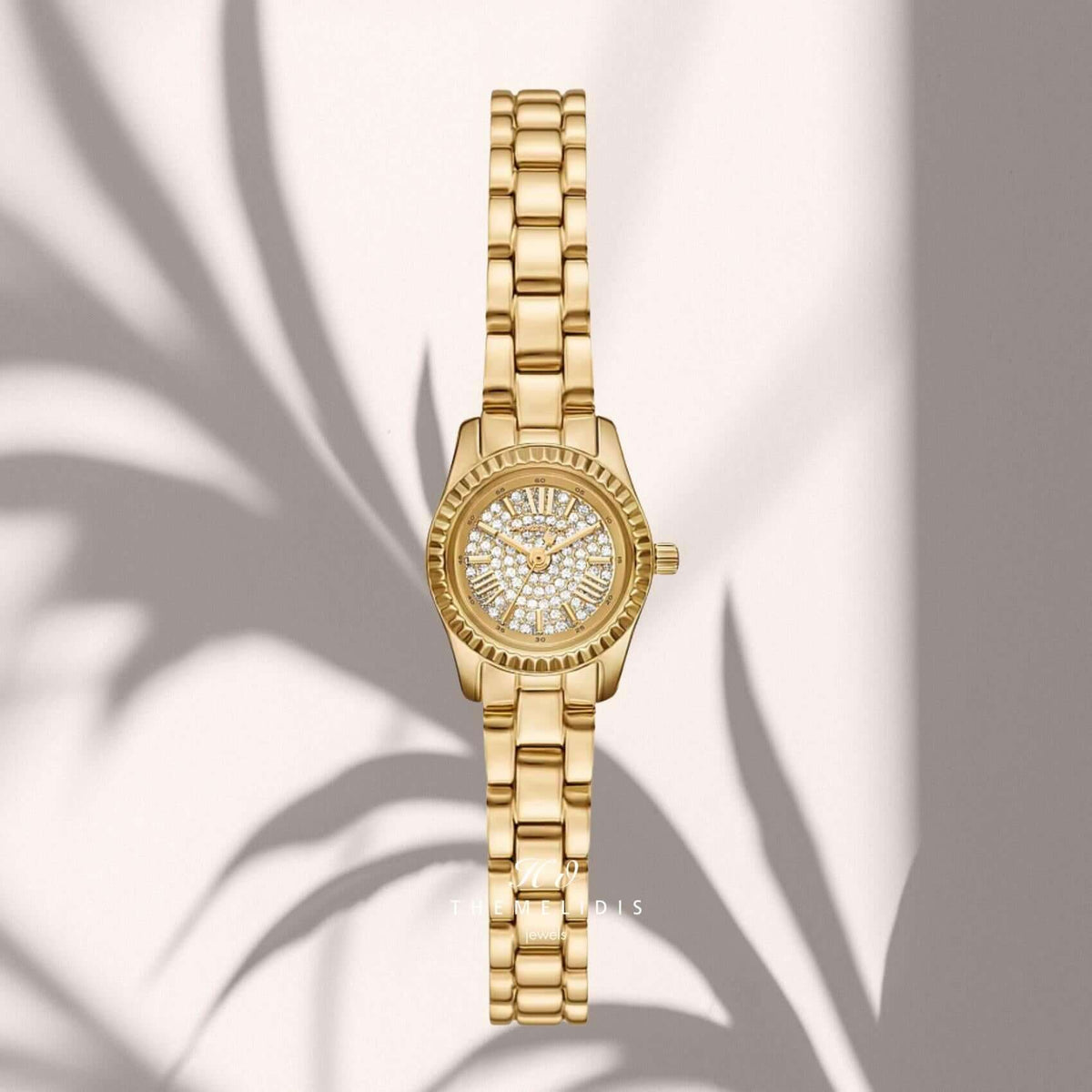 Γυναικείο ρολόι Michael Kors Petite Lexington MK4944SET με λευκό καντράν 19mm, λαμπερά ζιργκόν και χρυσό μπρασελέ από ανοξείδωτο ατσάλι.