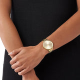 Γυναικείο ρολόι Michael Kors Pyper MK3898 με χρυσό ατσάλινο μπρασελέ, στρογγυλό χρυσό καντράν με ζιργκόν και στεφάνι 37mm.