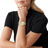 Γυναικείο ρολόι Michael Kors Pyper MK4339 με χρυσό ατσάλινο μπρασελέ, στρογγυλό χρυσό καντράν με ζιργκόν και στεφάνι 37mm.