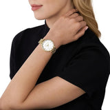 Γυναικείο ρολόι Michael Kors Pyper MK4666 με χρυσό ατσάλινο μπρασελέ, στρογγυλό άσπρο καντράν με ζιργκόν και στεφάνι 37mm.