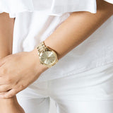 Γυναικείο ρολόι Michael Kors Slim Runway MK3179 με χρυσό ατσάλινο μπρασελέ, στρογγυλό χρυσό καντράν και στεφάνι 42mm.