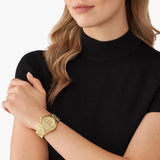Γυναικείο ρολόι χρονογράφος Michael Kors Runway MK7323 με χρυσό ατσάλινο μπρασελέ και χρυσό καντράν διαμέτρου 38mm.