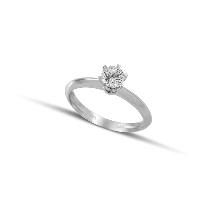 Μονόπετρο δαχτυλίδι OS073 από λευκόχρυσο 14Κ με κεντρικό ζιργκόν σε εξάδοντο καστόνι σε κλασική διαχρονική γραμμή.