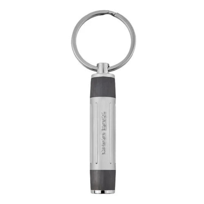 Ασημί και μαύρο μπρελόκ HUGO BOSS HAK306D από ατσάλινο υλικό με κυλινδρικό design της σειράς Gear Ribs