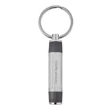 Ασημί και μαύρο μπρελόκ HUGO BOSS HAK306D από ατσάλινο υλικό με κυλινδρικό design της σειράς Gear Ribs