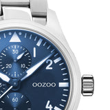 Ρολόι Oozoo C10955 με ασημί ατσάλινο μπρασελέ ,μπλε καντράν διαμέτρου 42mm και μηχανισμό μπαταρίας quartz.