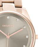 Ρολόι Oozoo C10963 με ροζ χρυσό ατσάλινο μπρασελέ, ροζ χρυσό καντράν διαμέτρου 36mm με ζιργκόν και μηχανισμό μπαταρίας quartz.