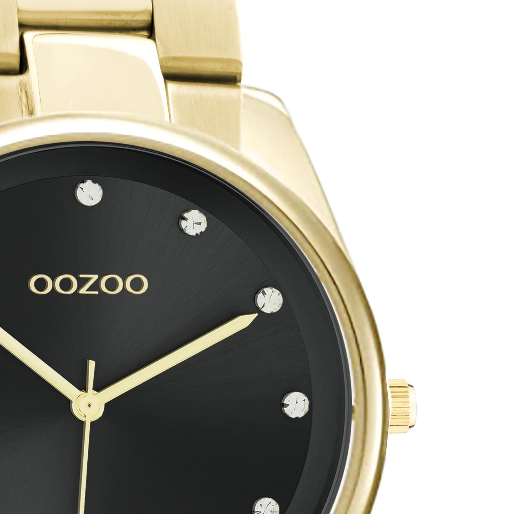 Ρολόι Oozoo C10965 με χρυσό ατσάλινο μπρασελέ, μαύρο καντράν διαμέτρου 36mm με ζιργκόν και μηχανισμό μπαταρίας quartz.