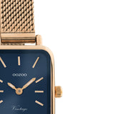 Τετράγωνο ρολόι Oozoo Vintage C10976 με ροζ χρυσό ατσάλινο μπρασελέ,μπλε καντράν 26x21mm και μηχανισμό μπαταρίας quartz.