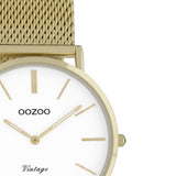 Ρολόι Oozoo Vintage C9911 με χρυσό ατσάλινο μπρασελέ,άσπρο κανράν, στρογγυλό στεφάνι διαμέτρου 32mm και μηχανισμό μπαταρίας quartz.