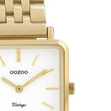 Τετράγωνο ρολόι Oozoo Vintage C9955 με χρυσό ατσάλινο μπρασελέ,άσπρο καντράν 29x29mm και μηχανισμό μπαταρίας quartz.