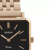 Τετράγωνο ρολόι Oozoo Vintage C9959 με ροζ χρυσό ατσάλινο μπρασελέ,μαύρο καντράν 29x29mm και μηχανισμό μπαταρίας quartz.