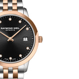 Ρολόι Raymond Weil Toccata Diamonds 5385-SP5-20081 με δίχρωμο μπρασελέ σε ασημί-ροζ χρυσό χρώμα και μαύρο καντράν 34mm με διαμάντια.