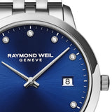 Ρολόι Raymond Weil Toccata Diamonds 5385-ST-50081 με ασημί μπρασελέ και μπλε καντράν 30mm με διαμάντια.