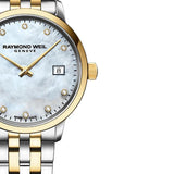 Γυναικείο ρολόι Raymond Weil Toccata Diamonds 5985-STP-97081 με δίχρωμο μπρασελέ σε ασημί-χρυσό χρώμα και άσπρο φίλντισι καντράν 29mm με διαμάντια.