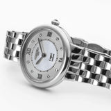 Roamer Capri 859845-41-29-50 με ασημί ατσάλινο μπρασελέ άσπρο φίλντισι καντράν με διαμάντια, μηχανισμό μπαταρίας quartz και κάσα διαμέτρου 30mm.