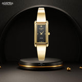 Γυναικείο ρολόι Roamer Elegance Diamond 866845-48-55-20 με χρυσό ατσάλινο μπρασελέ και μαύρό τετράγωνο φίλντισι καντράν διαμέτρου 32mm με διαμάντια.