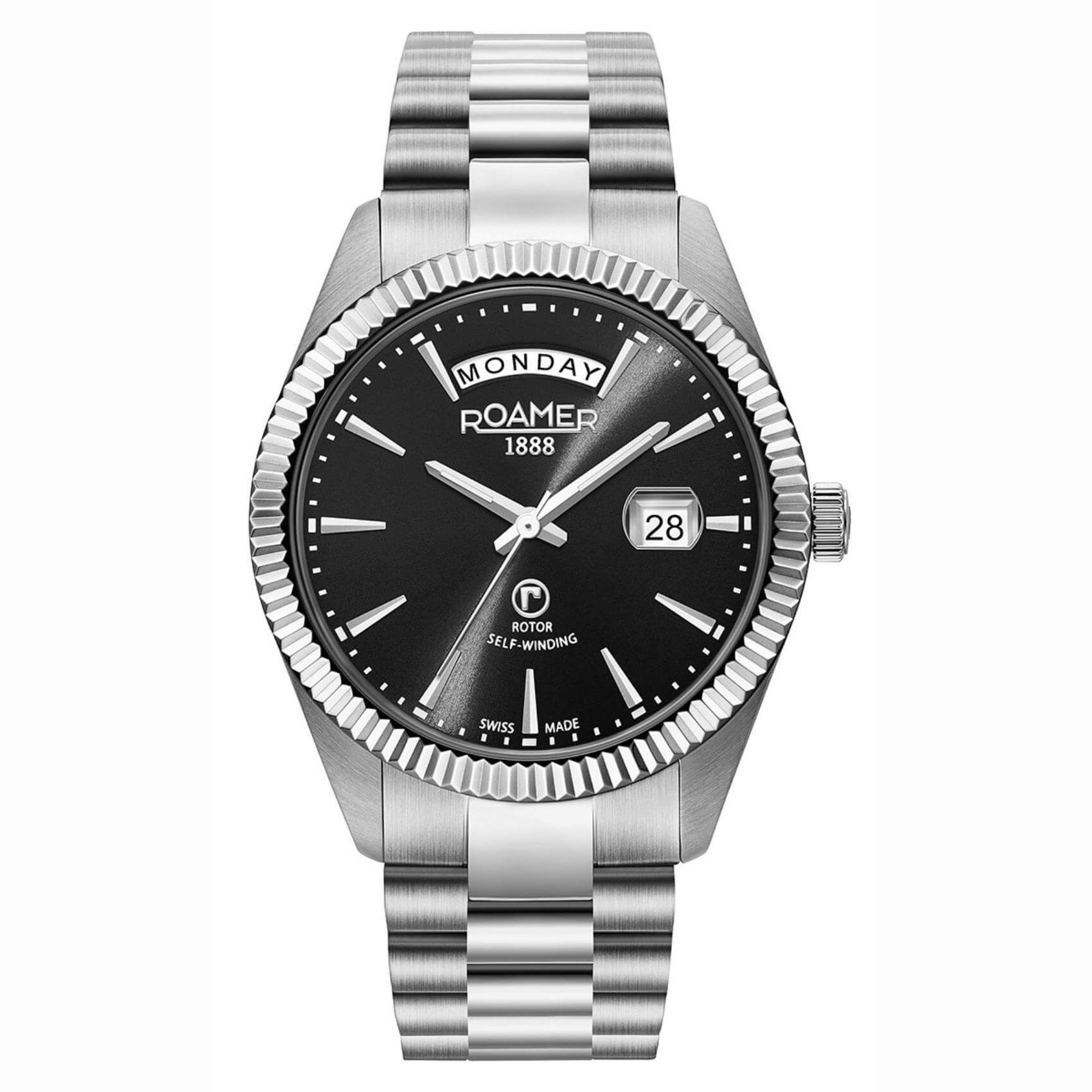 Αυτόματο ρολόι open back Roamer Primeline Day Date 981662-41-55-90 με ασημί μπρασελέ, μαύρο καντράν με ένδειξη ημέρας και ημερομηνίας και κάσα διαμέτρου 42mm.