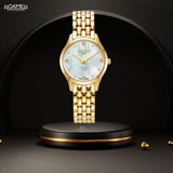 Γυναικείο ρολόι Roamer Soleure Diamond 547857-48-25-50 με χρυσό ατσάλινο μπρασελέ και άσπρο φίλντισι καντράν διαμέτρου 30mm με διαμάντια.