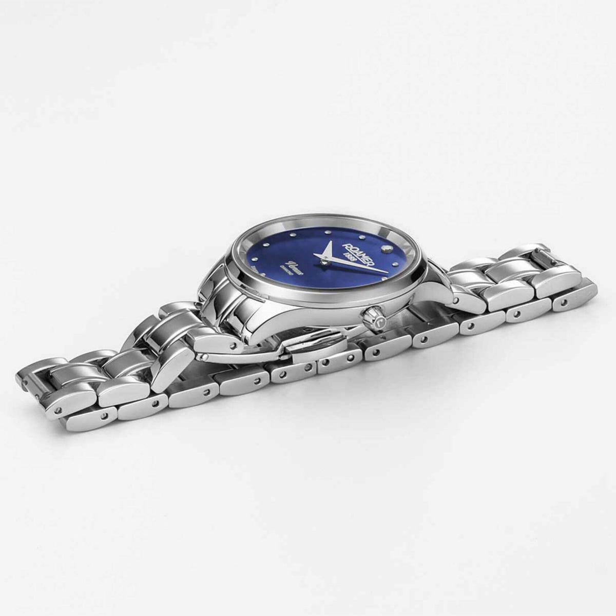 Ρολόι Roamer Venus Diamonds 601857-41-49-20 με ασημί ατσάλινο μπρασελέ, μπλε φίλντισι καντράν με διαμάντια, μηχανισμό μπαταρίας quartz, τζαμάκι από ζαφείρι και στεφάνι διαμέτρου 30mm.