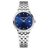 Γυναικείο ρολόι Raymond Weil Toccata Diamonds 5985-ST-50081 με ασημί μπρασελέ και μπλε καντράν 29mm με διαμάντια.