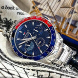 Αντρικό ρολόι Tommy Hilfiger Owen 1791968 με ασημί ατσάλινο μπρασελέ και μπλε καντράν διαμέτρου 46mm.