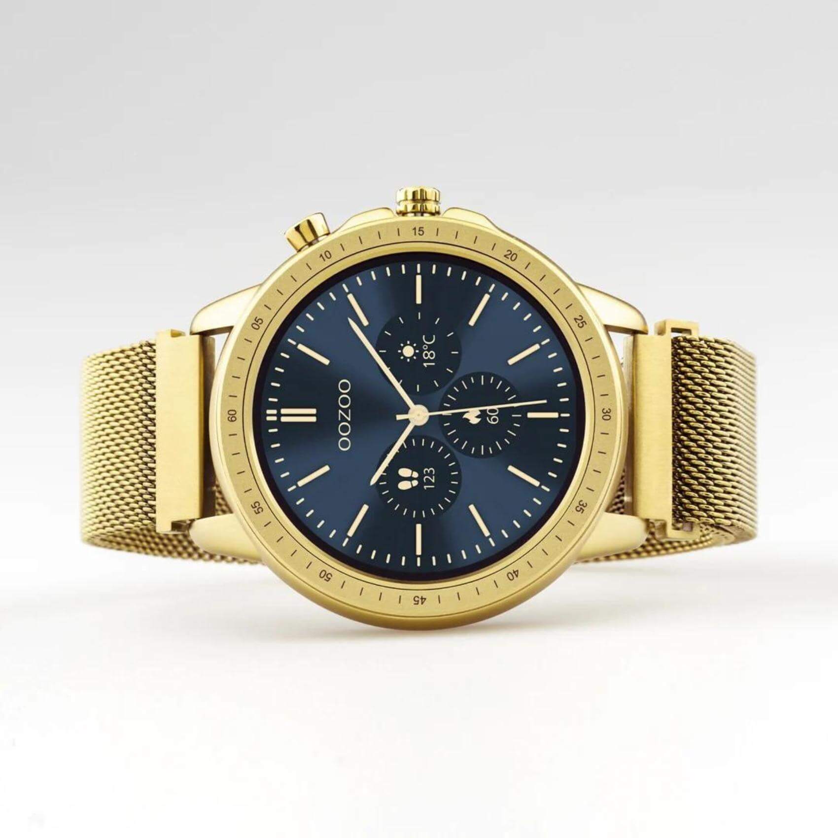 Smartwatch Oozoo Q00306 με χρυσό ατσάλινο μπρασελέ και χρυσή κάσα, οθόνη διάμετρου 45mm με λειτουργίες μέτρησης θερμιδών, βημάτων, καρδιακών παλμών και σύνδεση σε κινητό με bluetooth.