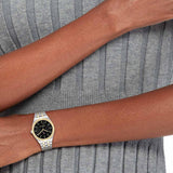 Γυναικείο ρολόι Tommy Hilfiger Rachel 1782549 με δίχρωμο ασημί-χρυσό ατσάλινο μπρασελέ και μαύρο καντράν διαμέτρου 34mm.