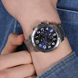 Αντρικό ρολόι Tommy Hilfiger Trent 1791053 χρονογράφος με ασημί ατσάλινο μπρασελέ και μπλε καντράν διαμέτρου 46mm.