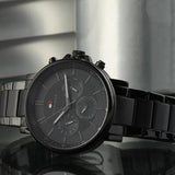 Ανδρικό ρολόι Tommy Hilfiger Tyson 1710590 με μαύρο ατσάλινο μπρασελέ και μαύρο καντράν διαμέτρου 44mm με ημερομηνία-ημέρα.