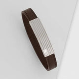 Ανδρικό βραχιόλι Calvin Klein 35000268 από καφέ δέρμα με ασημένια αγκράφα.