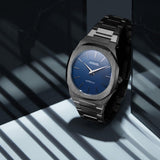 Ρολόι D1 Milano Ultra Thin D1-UTBJ12, με ανθρακί μπρασελέ από ανοξείδωτο ατσάλι, μπλε καντράν και οκτάγωνο στεφάνι με διάμετρο 40mm.