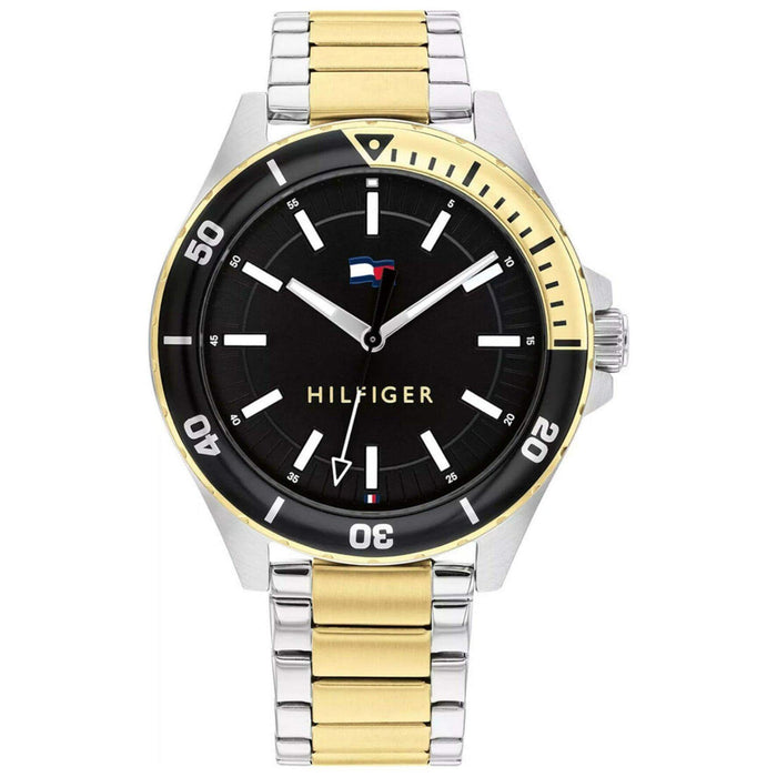Ανδρικό ρολόι Tommy Hilfiger Logan 1792013, με δίχρωμο μπρασελέ σε ασημί-χρυσό χρώμα από ανοξείδωτο ατσάλι και μαύρο καντράν.
