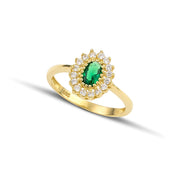 Χρυσό δαχτυλίδι Κ14 ροζέτα με πράσινη πέτρα, σε μοντέλο.