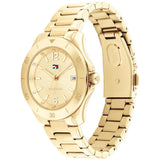 Γυναικείο ρολόι Tommy Hilfiger Brooke 1782513, με μπρασελέ σε χρυσό χρώμα από ανοξείδωτο ατσάλι και χρυσό καντράν με λειτουργία ημερομηνίας.