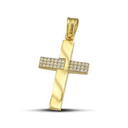 Χρυσός σταυρός βάπτισης για γυναίκα, κατασκευασμένος από χρυσό Κ14, με ζιργκόν και λουστράτες λεπτομέρειες, φορεμένος σε μοντέλο.