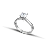Λευκόχρυσο μονόπετρο με διαμάντι, με καστόνι σε σχήμα "V" και λεπτομέρειες σε σχήμα καρδιάς.