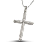 Γυναικείος σταυρός από λευκόχρυσο Κ18 με διαμάντια, περασμένος σε αλυσίδα.