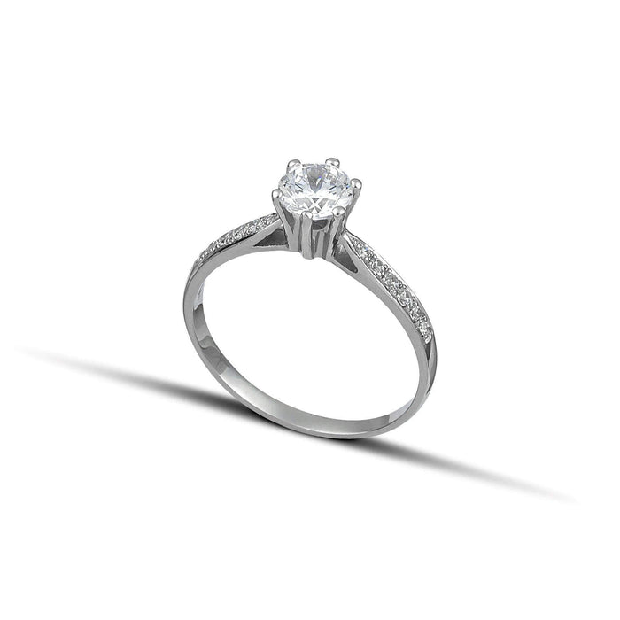 Μονόπετρο δαχτυλίδι OS010 από λευκόχρυσο 14Κ με κεντρικό ζιργκόν  με καρφωτές πέτρες και κομψή διαχρονική γραμμή.