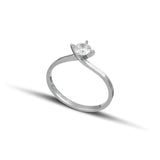 Λευκόχρυσο μονόπετρο δαχτυλίδι με διαμάντι και δέσιμο φλόγας. 