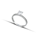 Μονόπετρο δαχτυλίδι με πλαϊνές πέτρες, κατασκευασμένο από λευκόχρυσο 14 καρατίων και ζιργκόν OS003.